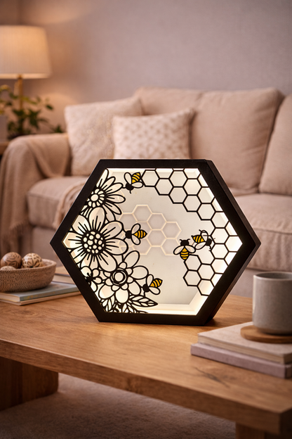 Decorative lamp with floral and honeycomb design on a wooden table in a living room.