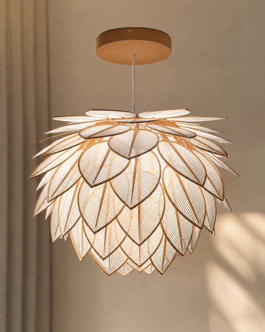 Leaf design ceiling pendant lamp glowing warm white in a neutral living room interior