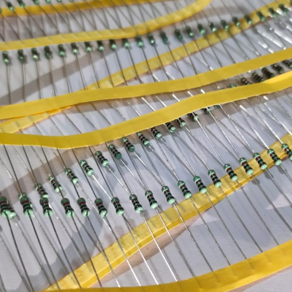 Close-up of resistors with yellow bands on a gray background