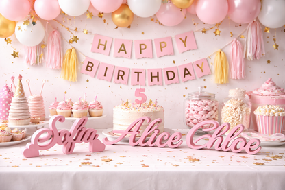 Birthday party setup with pink 'Happy Birthday' banner, cake, and personalized name sign.