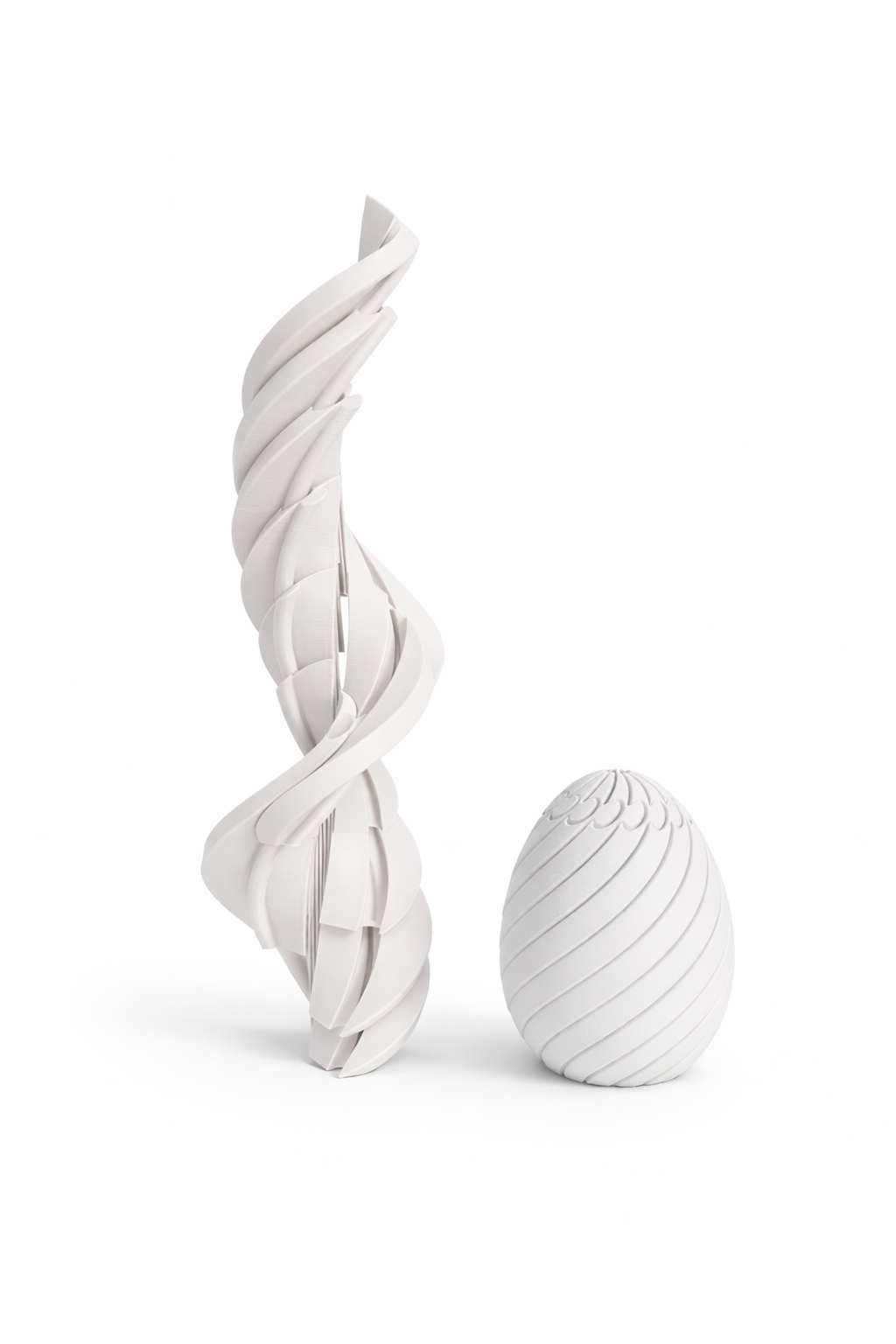 White marble sculpture with a twisted design on a white background