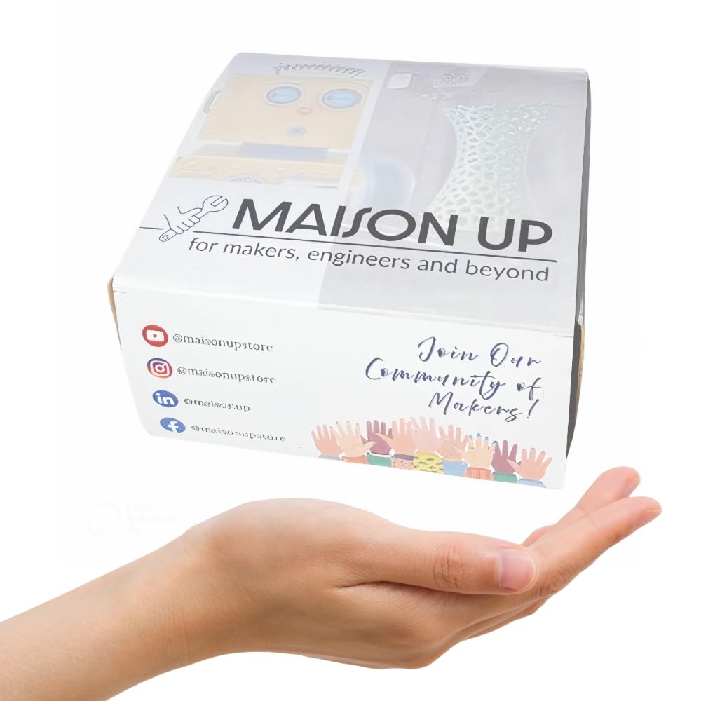 Maison Up packaging held in a hand with a white background