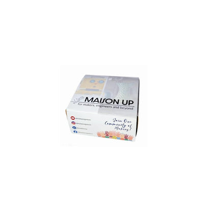 Maison Up packaging held in a hand with a white background