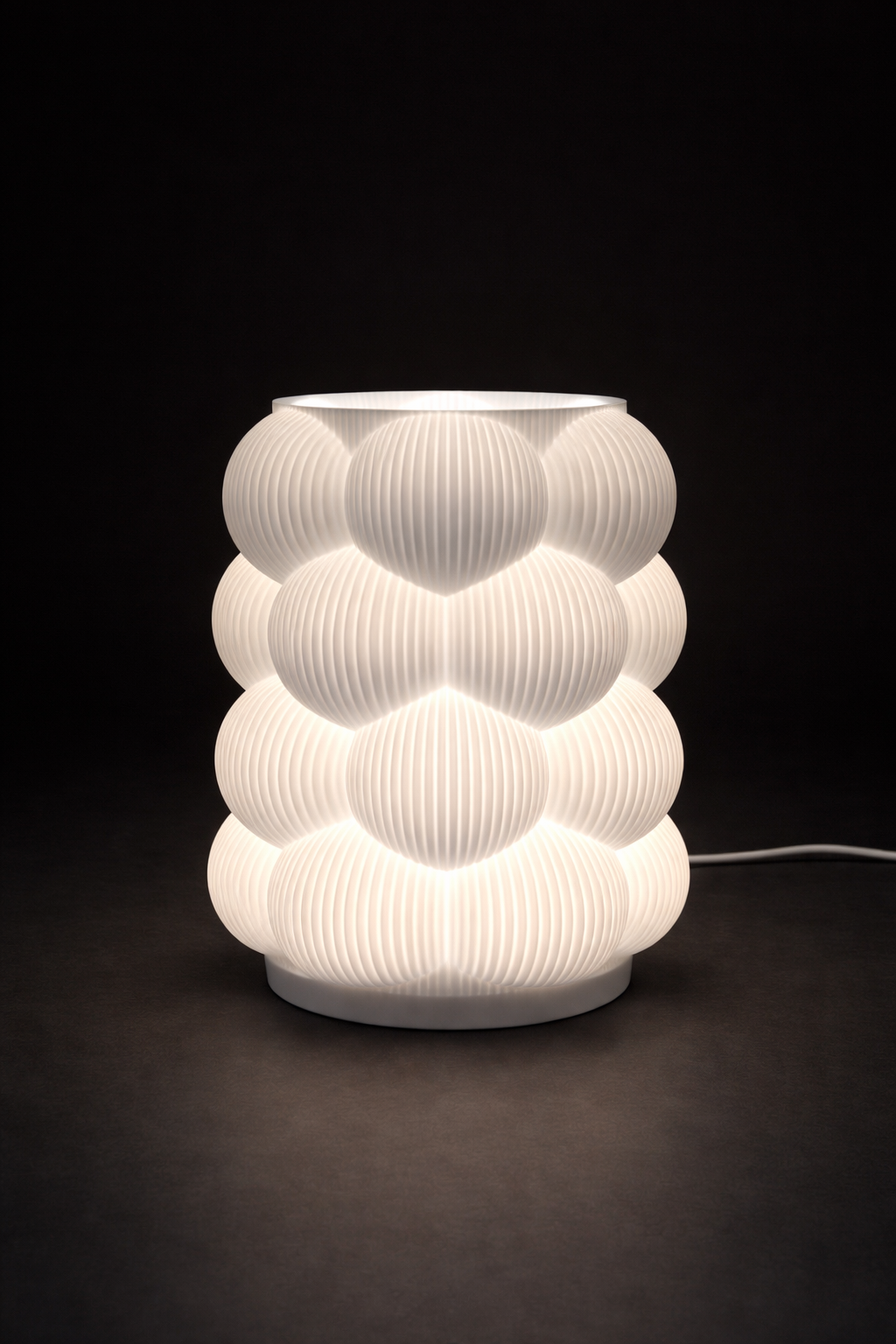 White textured table lamp on a dark background