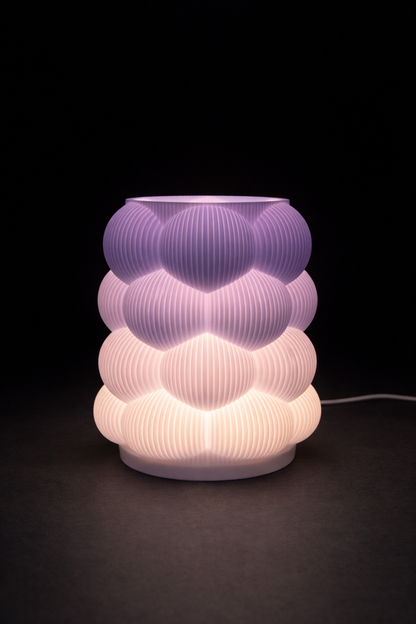 Decorative lamp with ribbed design on a black background