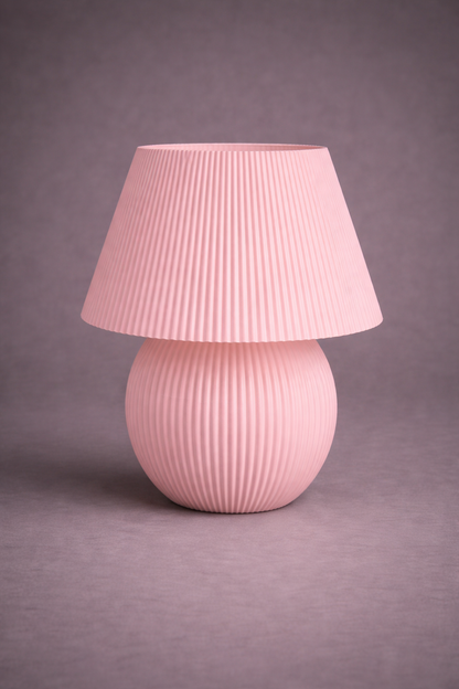Pink textured table lamp on a gray background