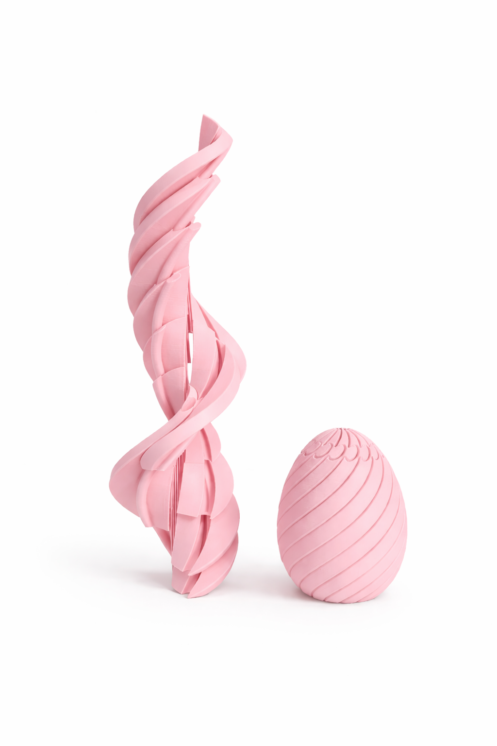 Two pink textured objects on a white background