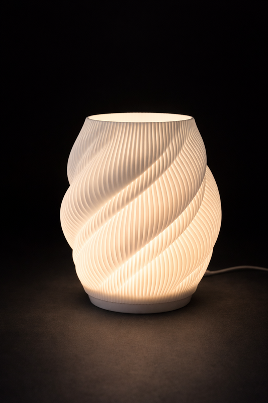 Twisted ceramic lamp with warm glow on a dark background