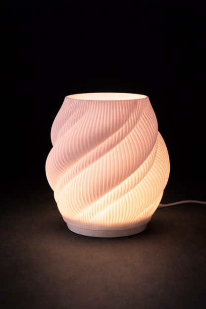 Pink textured table lamp on a dark background