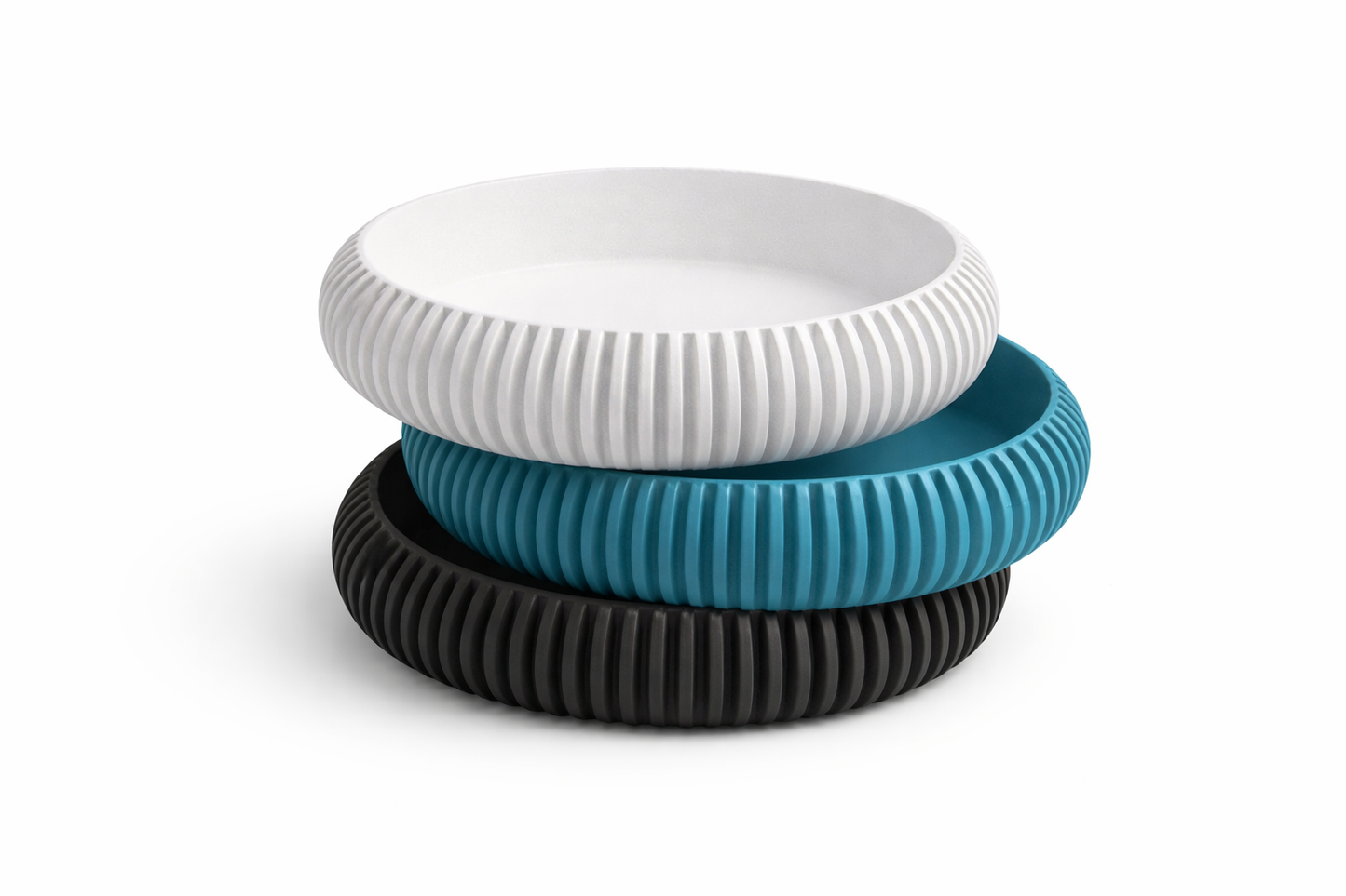 Three ribbed containers in white, blue, and black on a white background