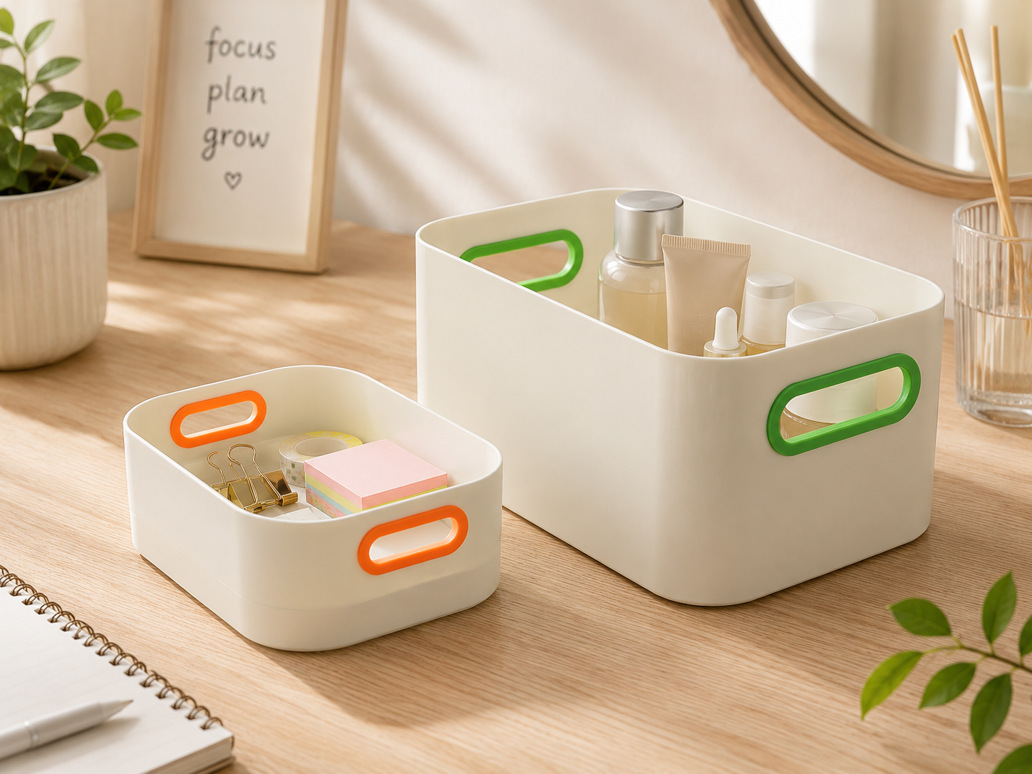 Two cream-colored plastic organizer bins with colorful handles, shown on a wooden desk with various cosmetic and stationery items.
