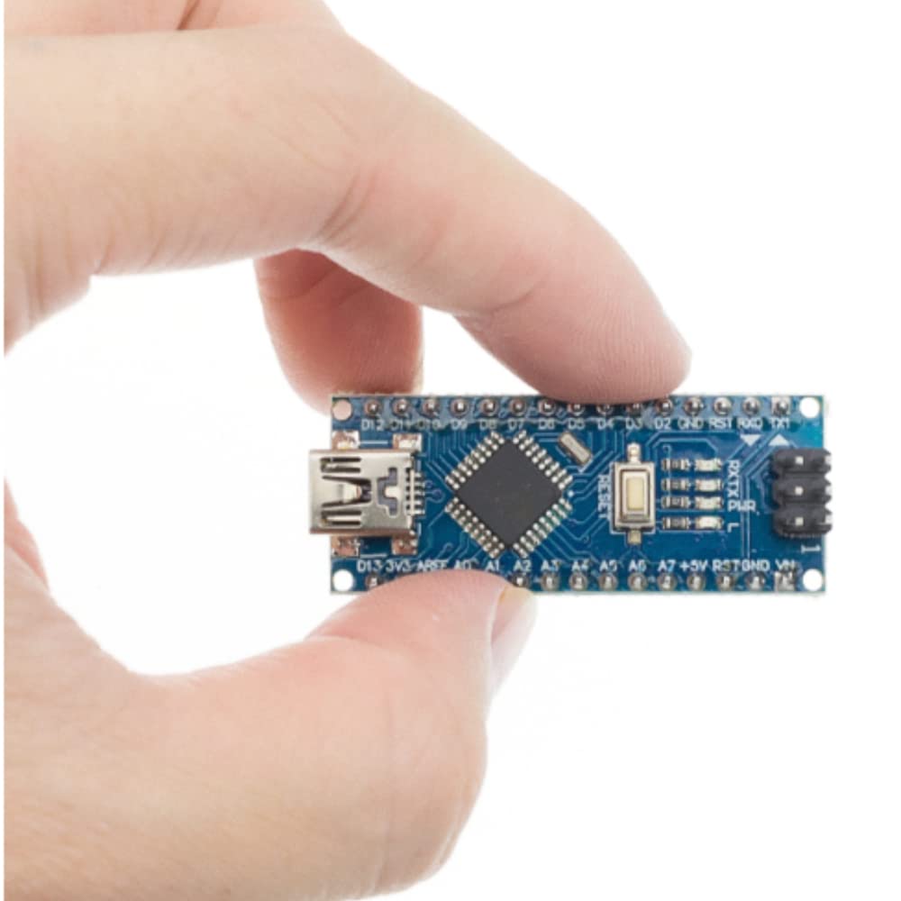 Hand holding a small blue circuit board against a white background