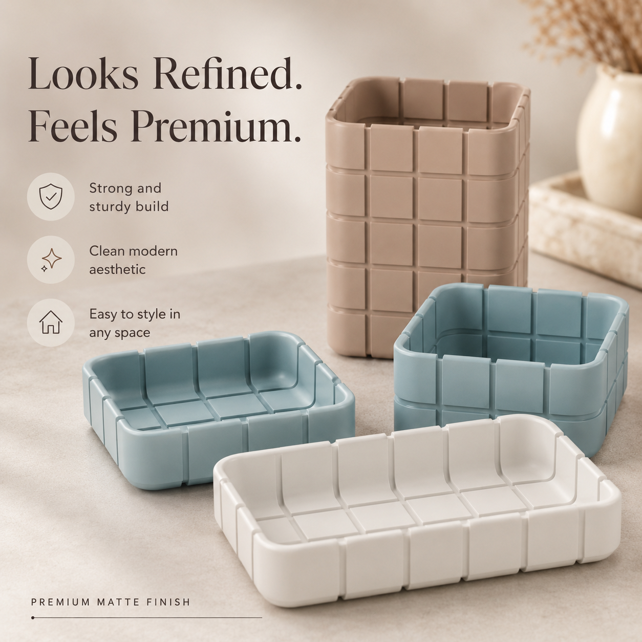 Three grid-patterned matte storage containers in beige, dusty blue, and white, displayed on a light beige surface with promotional text on the left.