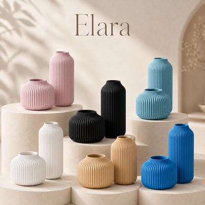 Six ribbed ceramic vases in assorted colors including pink, black, blue, beige, and white, arranged on beige pedestals with the brand name 'Elara' displayed at the top.