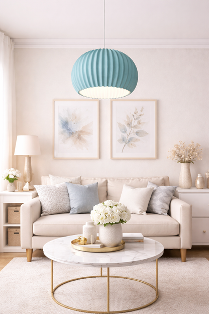 Modern living room with beige sofa, marble coffee table, and decorative elements.