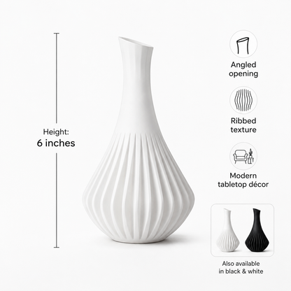 A white ribbed ceramic vase with a flared neck and angled opening, shown on a light gray background with product feature icons and text noting a 6-inch height and available black-and-white color options.