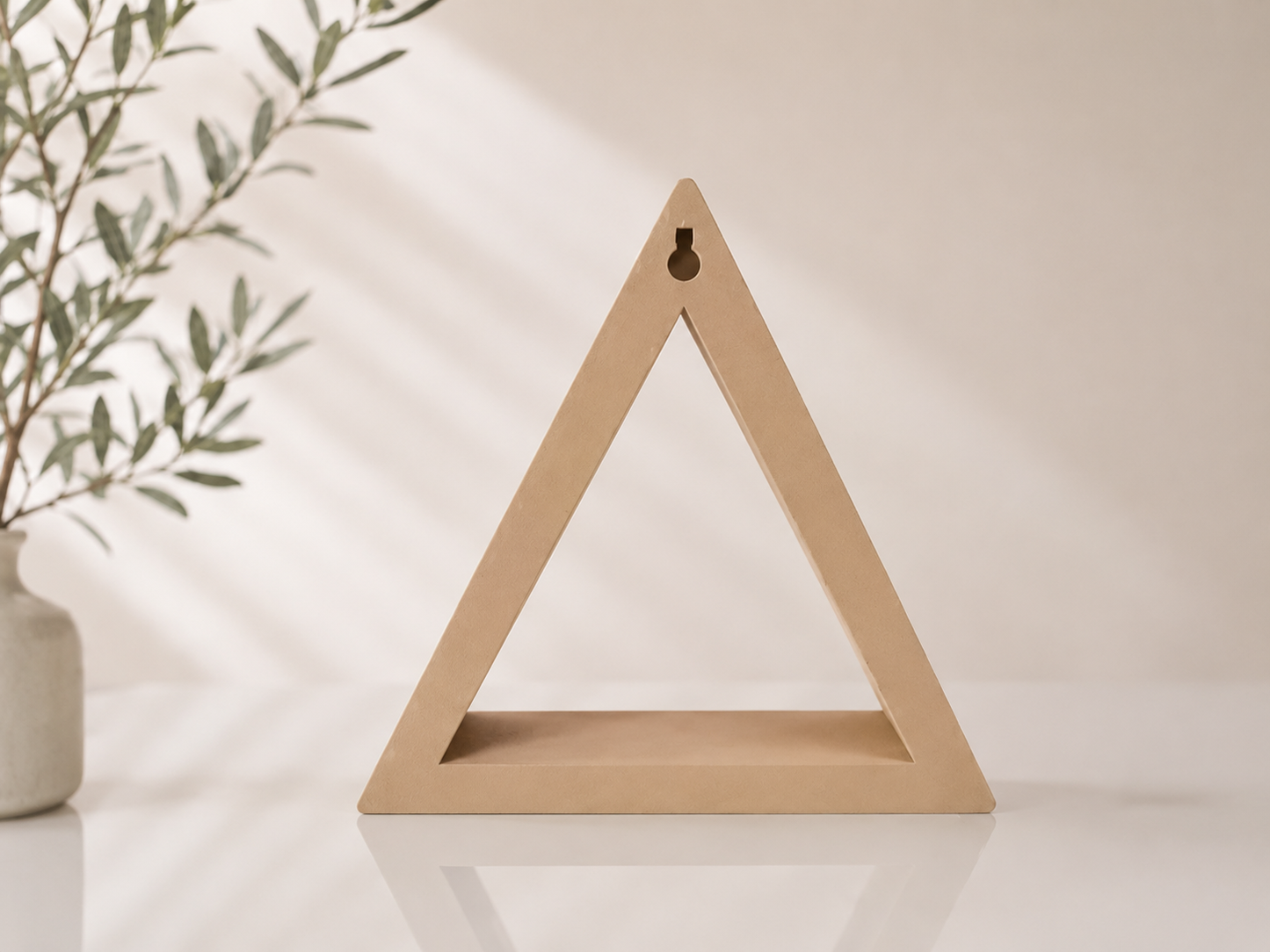 Beige brown triangle ShapeScape floating wall shelf shown in a clean product view