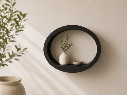 Black round ShapeScape geometric floating wall shelf styled with ceramic vase and bowl