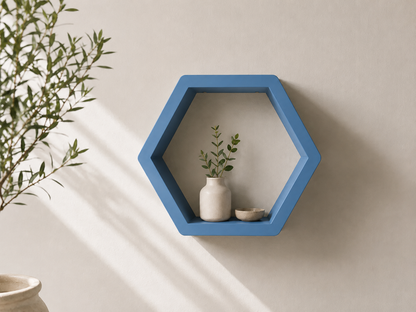 Blue hexagon ShapeScape geometric floating wall shelf styled with ceramic decor