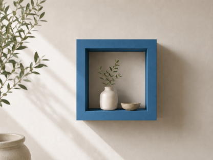 Blue square ShapeScape geometric floating wall shelf styled with ceramic decor