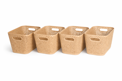 Four woven baskets of varying sizes on a white background