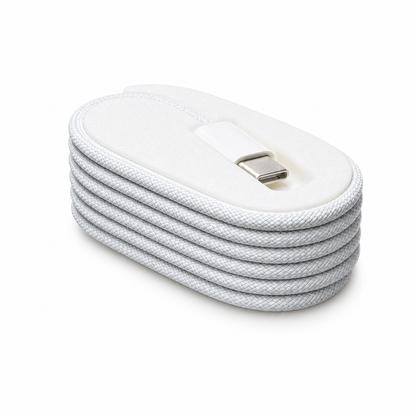 White USB-C cable organizer clip with braided charging cable neatly wrapped for desk and travel storage