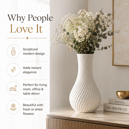 A tall white ribbed ceramic vase filled with white dried flowers, displayed on a wooden cabinet in a styled interior setting. The left side features marketing text reading 'Why People Love It' with bullet points about sculptural modern design, instant elegance, suitability for living room/office/table decor, and beautiful presentation with fresh or dried flowers.