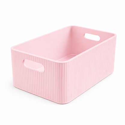 Pink storage basket with handles on a white background